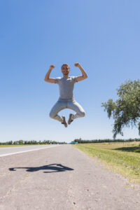 boy-jumping-road