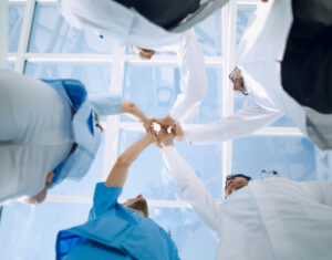 Low Angle View Of Medical Team Stacking Hands