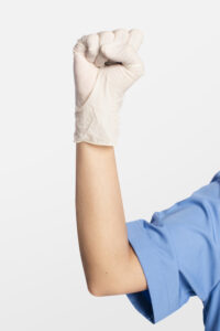 Medical gloves showing a fist